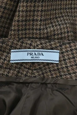 Brown wool houndstooth check tweed pull-on low-rise tapered leg tailored trousers with extended tab closure