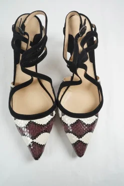 Burgundy and black python-embossed leather pointed-toe slingback pumps with criss-cross straps