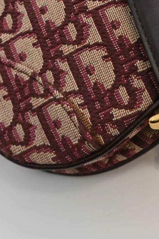 Burgundy and ecru Oblique monogram jacquard fabric and leather saddle bag with detachable shoulder strap