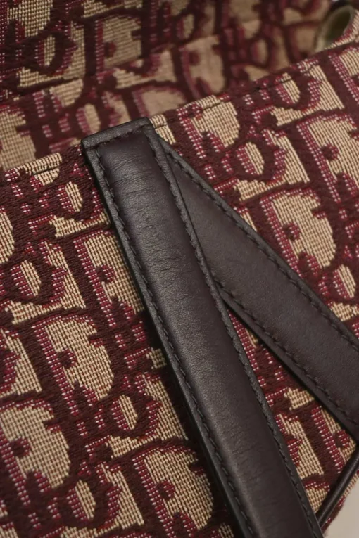 Burgundy and ecru Oblique monogram jacquard fabric and leather saddle bag with detachable shoulder strap