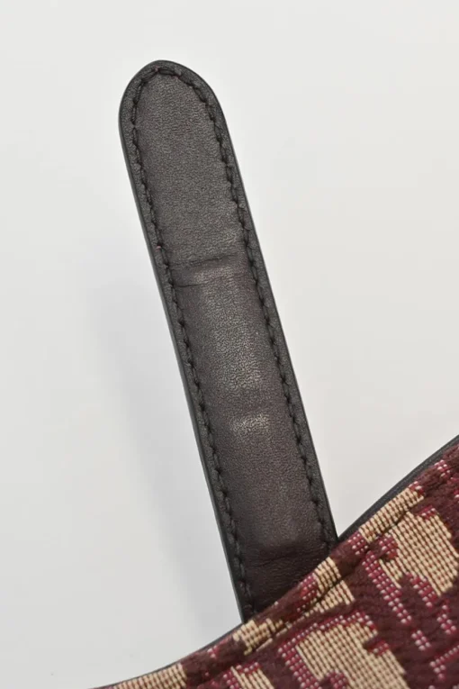 Burgundy and ecru Oblique monogram jacquard fabric and leather saddle bag with detachable shoulder strap