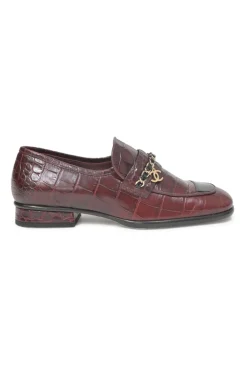 Burgundy croc-embossed leather slip-on loafers featuring chainlink Coco Mark charm vamp appliqué