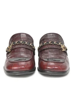 Burgundy croc-embossed leather slip-on loafers featuring chainlink Coco Mark charm vamp appliqué