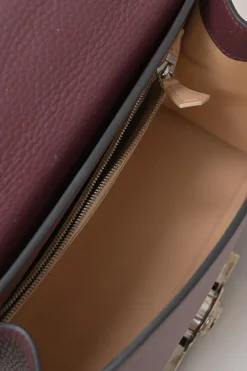 Burgundy grained leather Réjane PM top handle bag with detachable shoulder strap