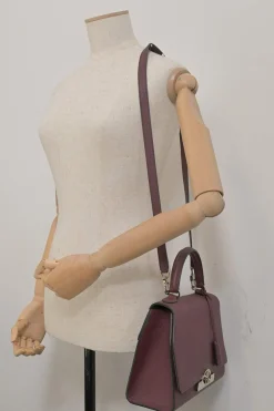 Burgundy grained leather Réjane PM top handle bag with detachable shoulder strap