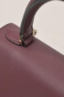 Burgundy grained leather Réjane PM top handle bag with detachable shoulder strap
