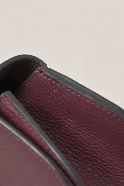 Burgundy grained leather Réjane PM top handle bag with detachable shoulder strap