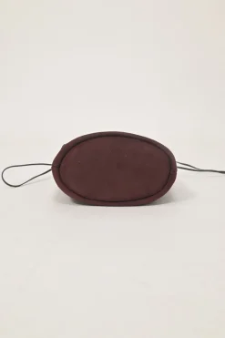 Burgundy grommet-embellished suede drawstring bucket pouch
