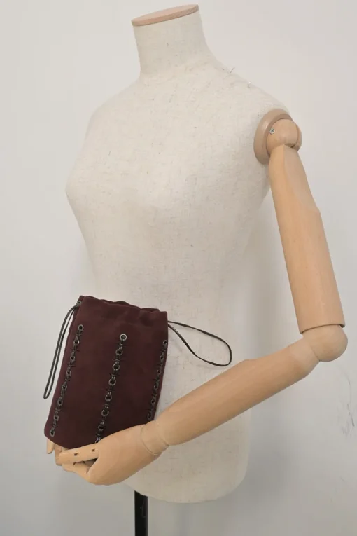 Burgundy grommet-embellished suede drawstring bucket pouch