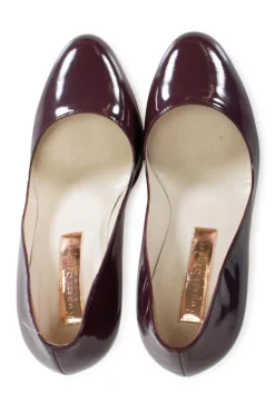 Burgundy patent leather high heeled pumps