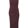 Burgundy two-piece skirt suit featuring sleeveless blouse and midi pencil skirt