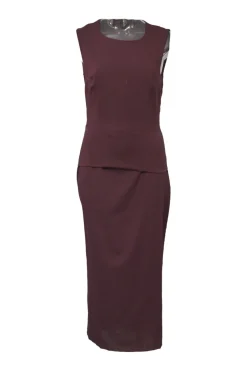 Burgundy two-piece skirt suit featuring sleeveless blouse and midi pencil skirt