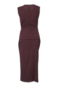 Burgundy two-piece skirt suit featuring sleeveless blouse and midi pencil skirt