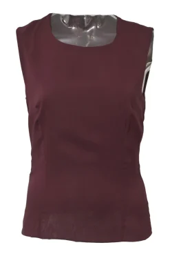 Burgundy two-piece skirt suit featuring sleeveless blouse and midi pencil skirt