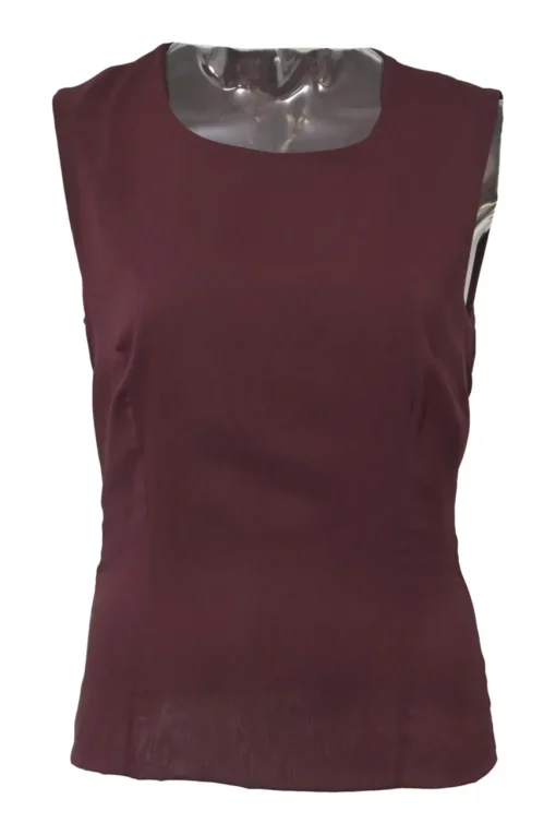 Burgundy two-piece skirt suit featuring sleeveless blouse and midi pencil skirt