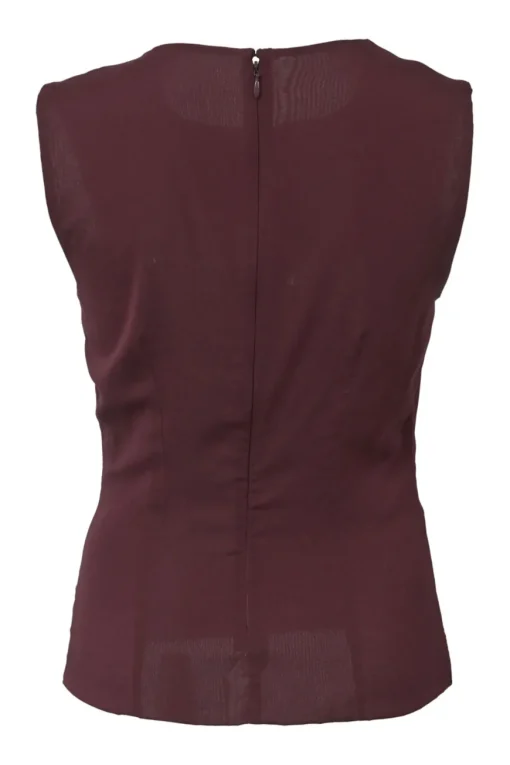 Burgundy two-piece skirt suit featuring sleeveless blouse and midi pencil skirt