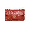 Chanel Quilted Crumpled Leather Accordion Flap Bag in Red Leather. Circa 2010-2011. Signature CC twistlock. Lined with burgundy leather. Three compartments. One zipped pocket. Antiqued gold-tone hardware.