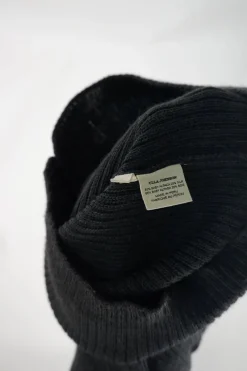 Charcoal alpaca-silk micro-rib Juliette sleeve turtleneck with self-covered shank button shoulder appliqué