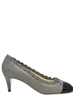 Charcoal leather round-toe ruffle edge cap toe pumps with topstitched Coco Mark detail