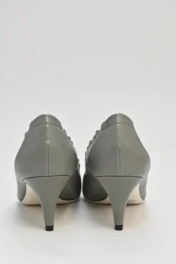 Charcoal leather round-toe ruffle edge cap toe pumps with topstitched Coco Mark detail