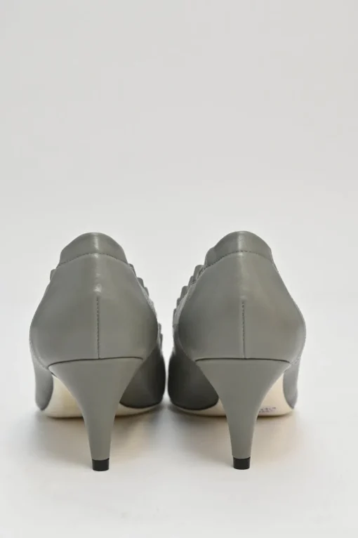 Charcoal leather round-toe ruffle edge cap toe pumps with topstitched Coco Mark detail