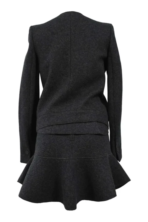 Charcoal merino melton three-piece set featuring collarless tailored jacket, strapless corset-style peplum top, and flounce mini skirt