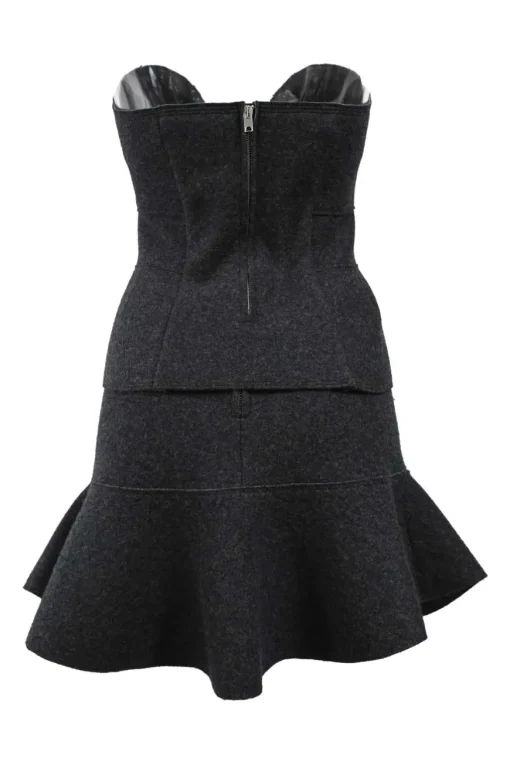 Charcoal merino melton three-piece set featuring collarless tailored jacket, strapless corset-style peplum top, and flounce mini skirt