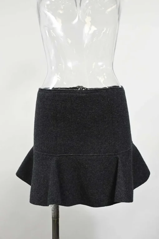 Charcoal merino melton three-piece set featuring collarless tailored jacket, strapless corset-style peplum top, and flounce mini skirt