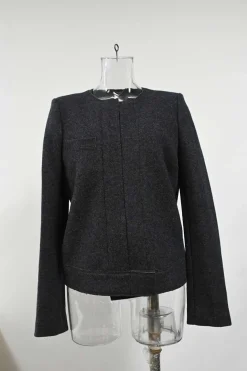 Charcoal merino melton three-piece set featuring collarless tailored jacket, strapless corset-style peplum top, and flounce mini skirt