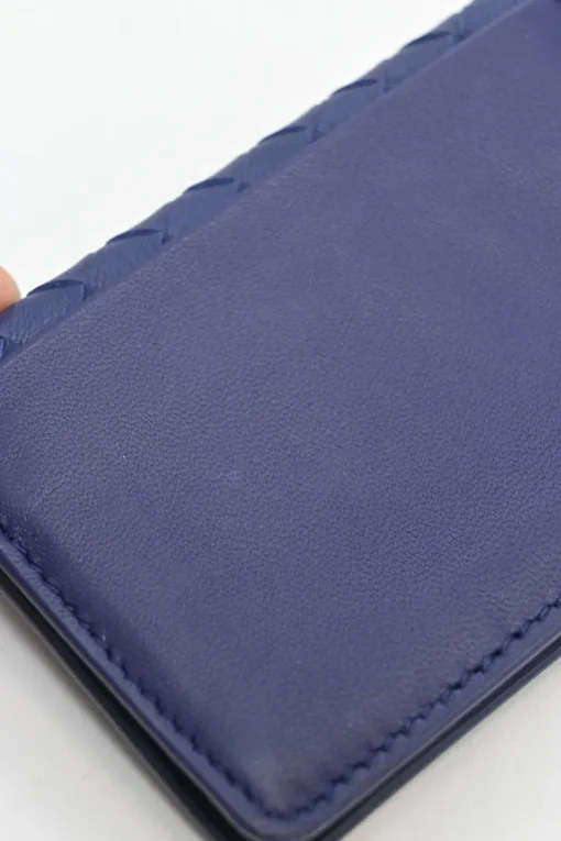 Cobalt blue intrecciato nappa leather accordion wallet with concealed snap closure