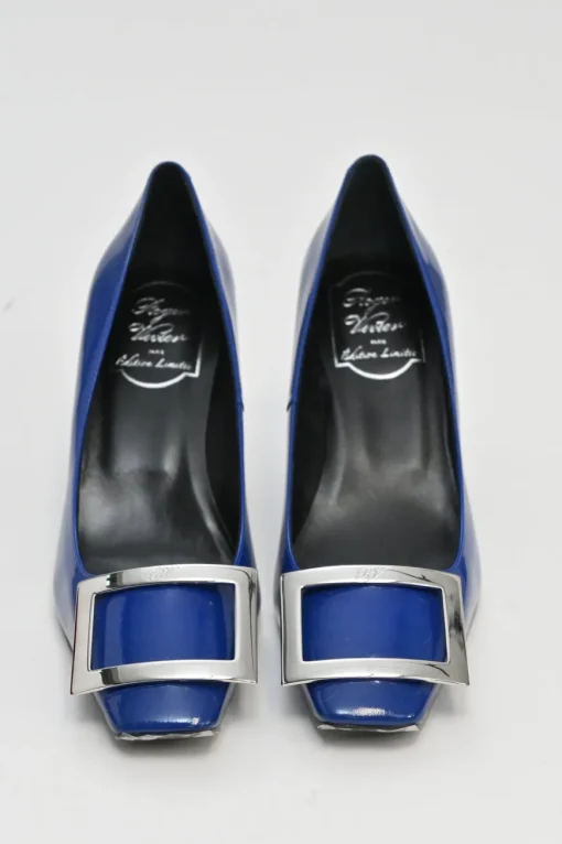 Cobalt blue patent leather limited-edition Trompette buckle pumps with mirrored signature comma heels