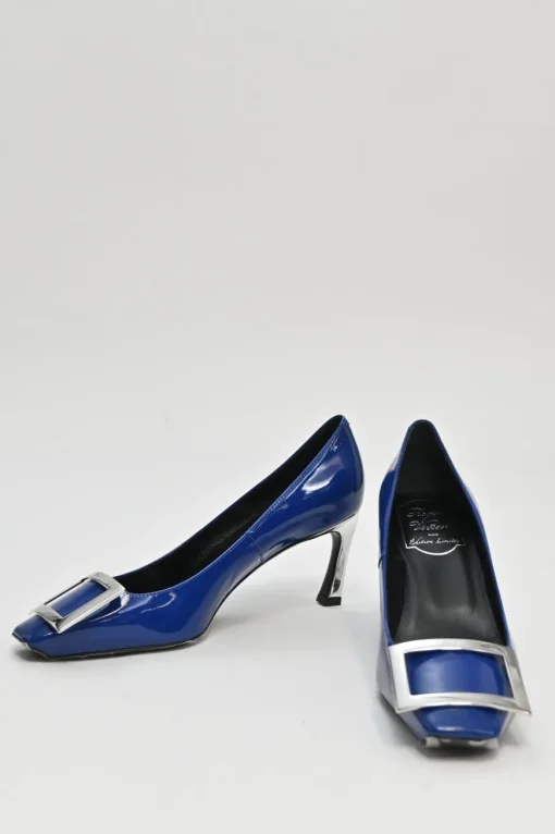 Cobalt blue patent leather limited-edition Trompette buckle pumps with mirrored signature comma heels
