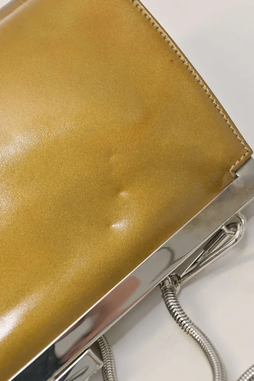 Copper patent leather crossbody kiss lock clutch with silver-tone metallic snake chain