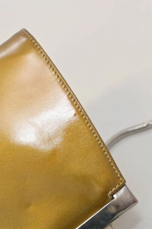 Copper patent leather crossbody kiss lock clutch with silver-tone metallic snake chain