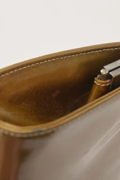 Copper patent leather crossbody kiss lock clutch with silver-tone metallic snake chain