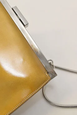 Copper patent leather crossbody kiss lock clutch with silver-tone metallic snake chain