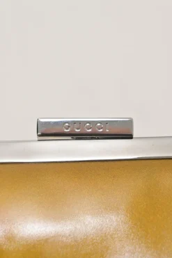 Copper patent leather crossbody kiss lock clutch with silver-tone metallic snake chain