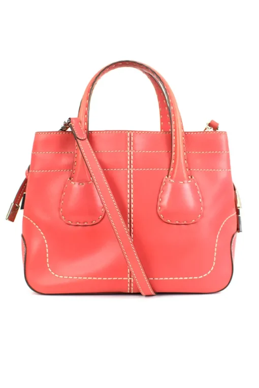 Coral leather satchel bag with visible top stitch and shoulder strap.