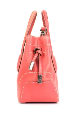 Coral leather satchel bag with visible top stitch and shoulder strap.