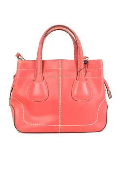 Coral leather satchel bag with visible top stitch and shoulder strap.