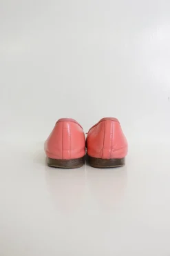 Coral pink and gold calfskin bow-embellished ballerinas with top-stitched Coco Mark cap toe