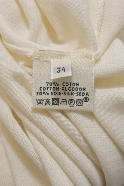 Cream cotton-silk interlock jersey knit V-neck long sleeve pullover top featuring pointelle H motif