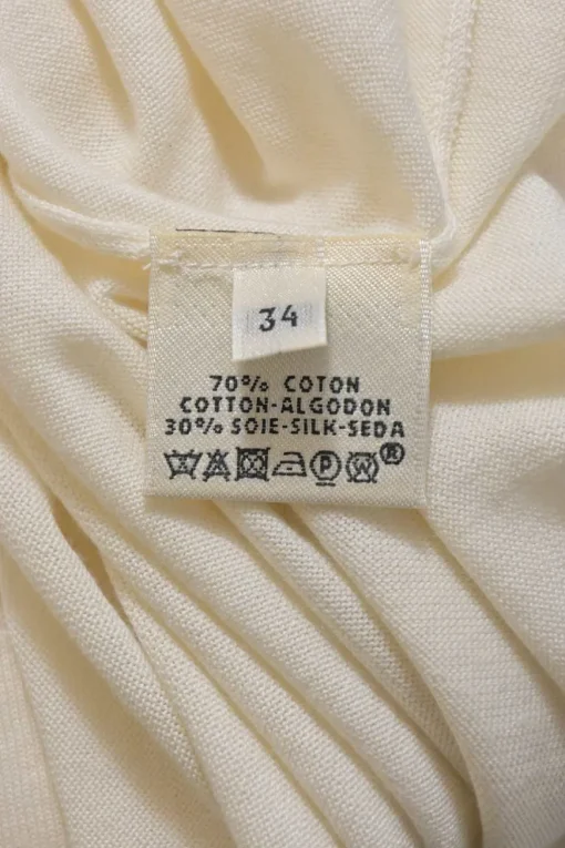 Cream cotton-silk interlock jersey knit V-neck long sleeve pullover top featuring pointelle H motif