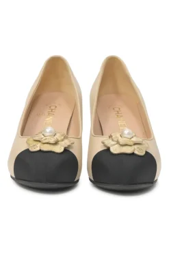Cream leather and grosgrain round-toe camellia platform pumps with contrasting toe caps