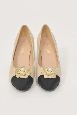 Cream leather and grosgrain round-toe camellia platform pumps with contrasting toe caps