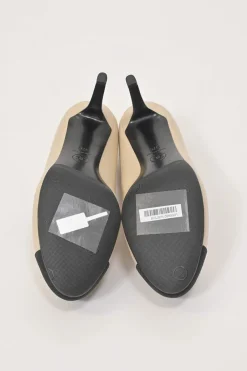Cream leather and grosgrain round-toe camellia platform pumps with contrasting toe caps