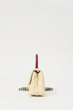 Cream matelassé caviar leather Coco Handle bag with ruthenium finish hardware and contrasting lizard skin trim appliqué