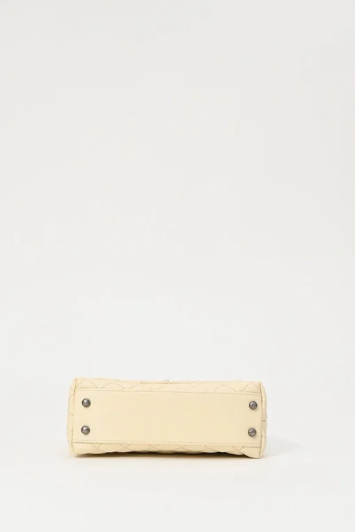 Cream matelassé caviar leather Coco Handle bag with ruthenium finish hardware and contrasting lizard skin trim appliqué