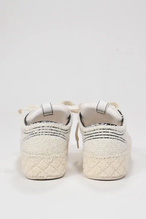 Cream matelassé terrycloth low-top platform sneakers with contrasting cap toe