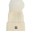 Cream merino wool circular rib beanie with faux fur pom pom